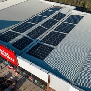 Aerial view of The Food Warehouse Wigan rooftop solar solutions provided by Ortus Energy.