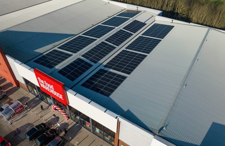Aerial view of The Food Warehouse Wigan rooftop solar solutions provided by Ortus Energy.