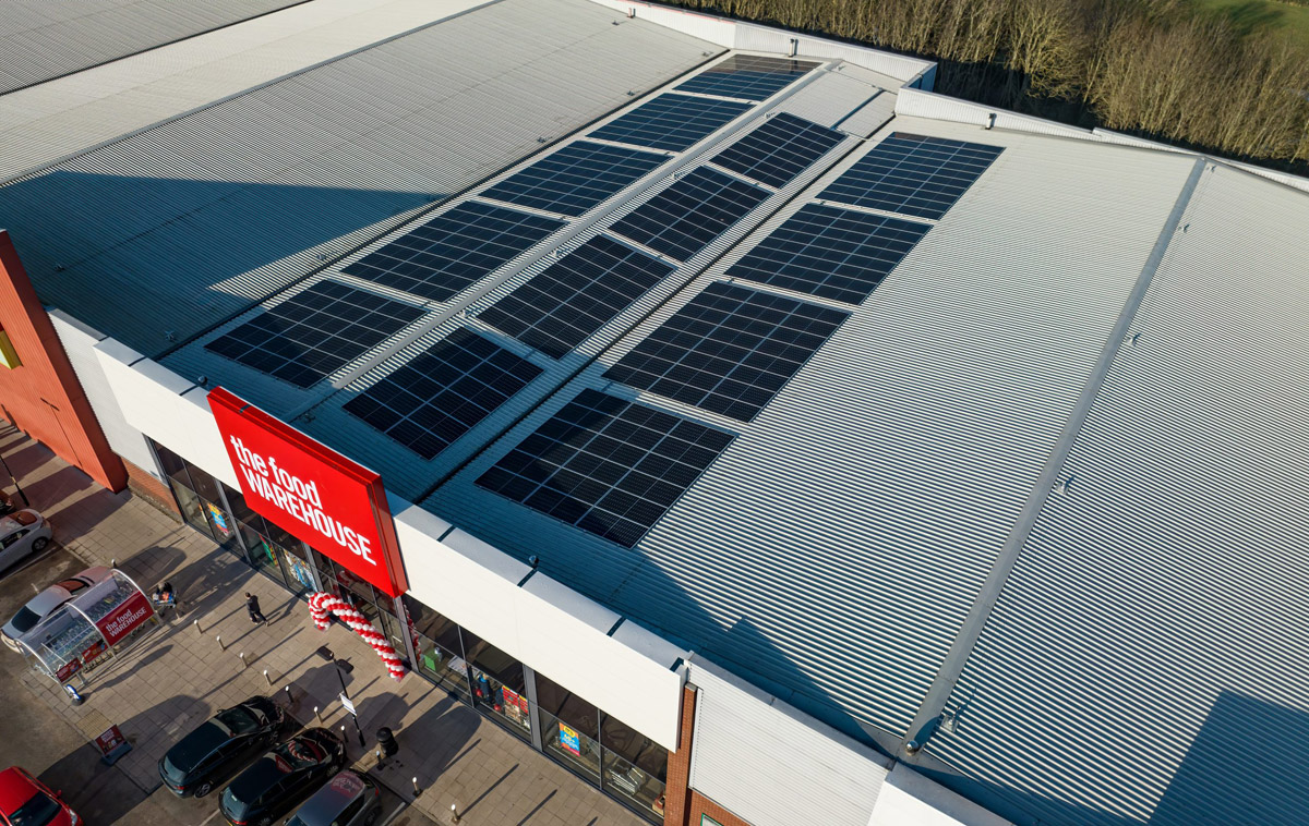 Aerial view of The Food Warehouse Wigan rooftop solar solutions provided by Ortus Energy.