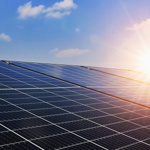 Bright and sunny rooftop solar panels harnessing renewable energy under clear blue skies.