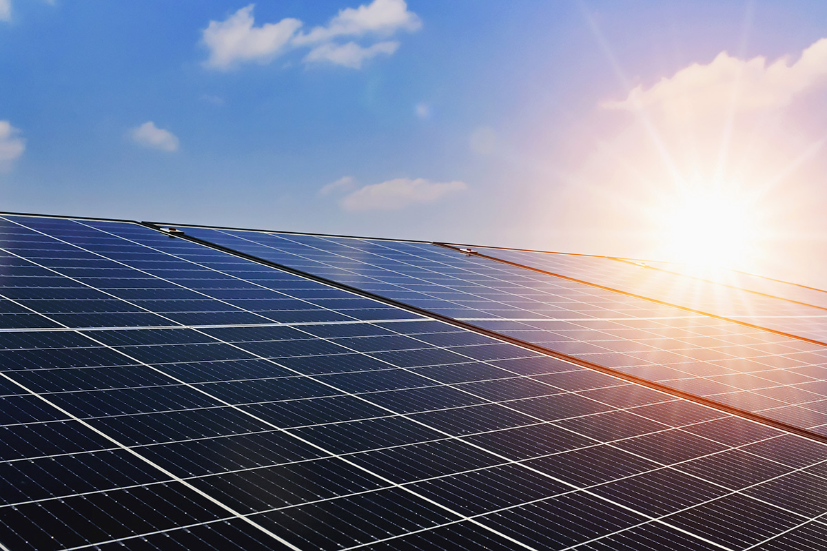 Bright and sunny rooftop solar panels harnessing renewable energy under clear blue skies.